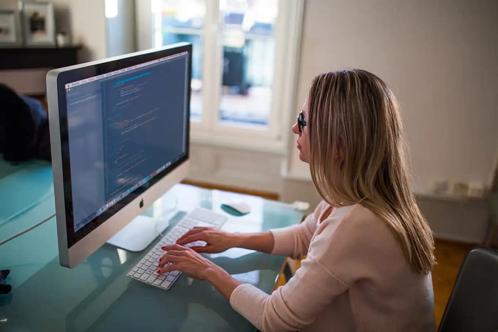 Woman learning web design at her computer