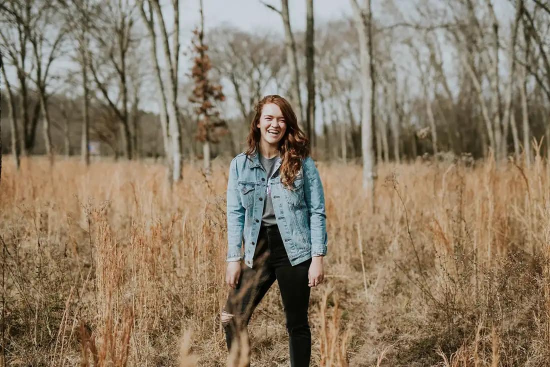 Laughing woman in a denim jacket