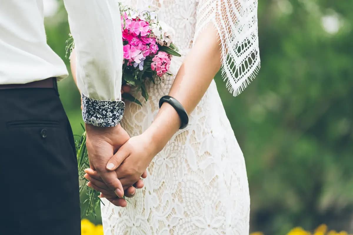 Bride and groom holding hands on their wedding day