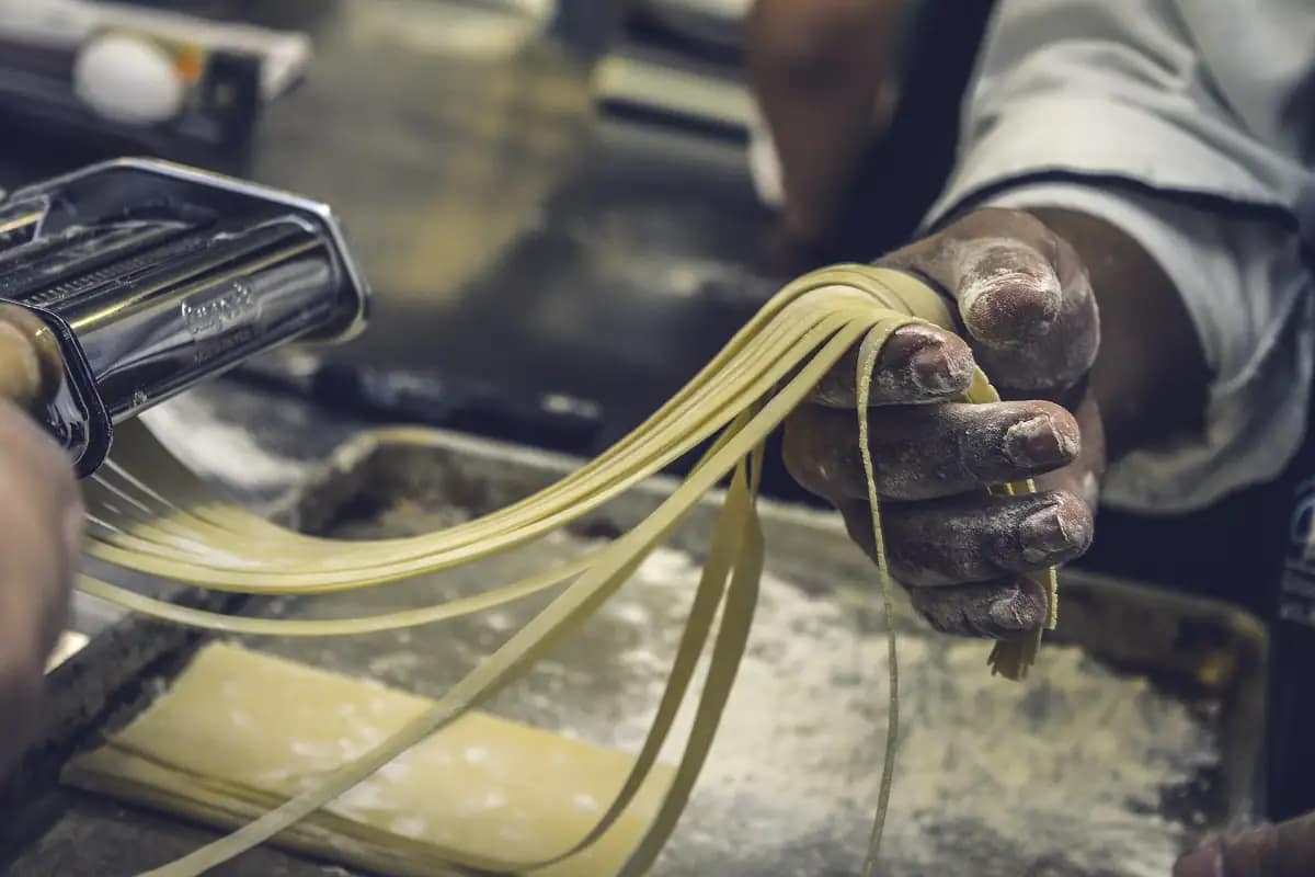 Chef making fresh pasta by hand