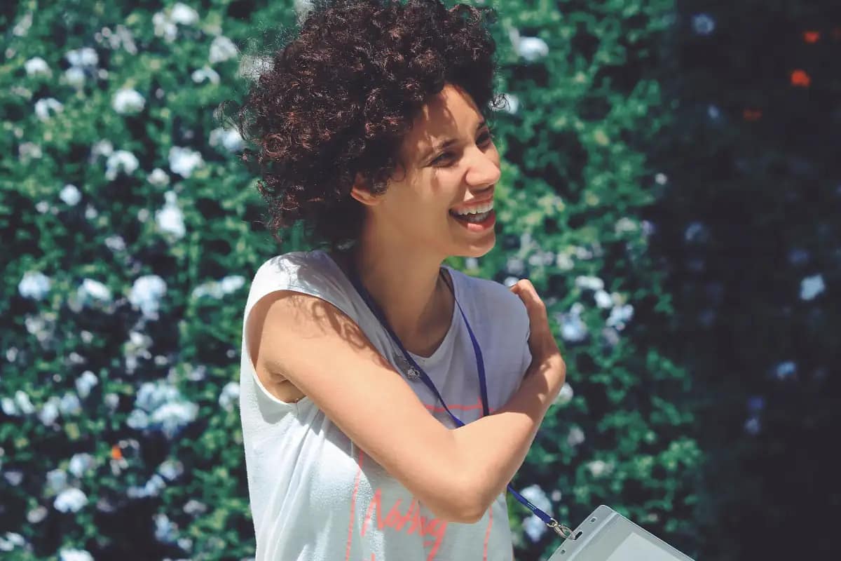 Happy woman laughing outdoors